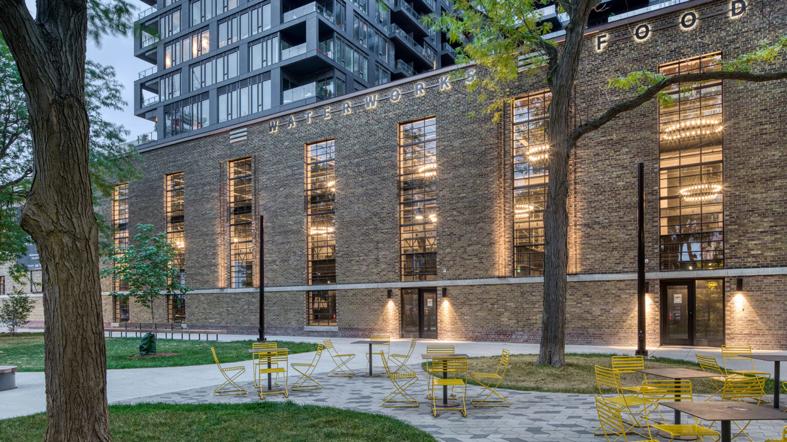 Waterworks Food Hall with trees and a park