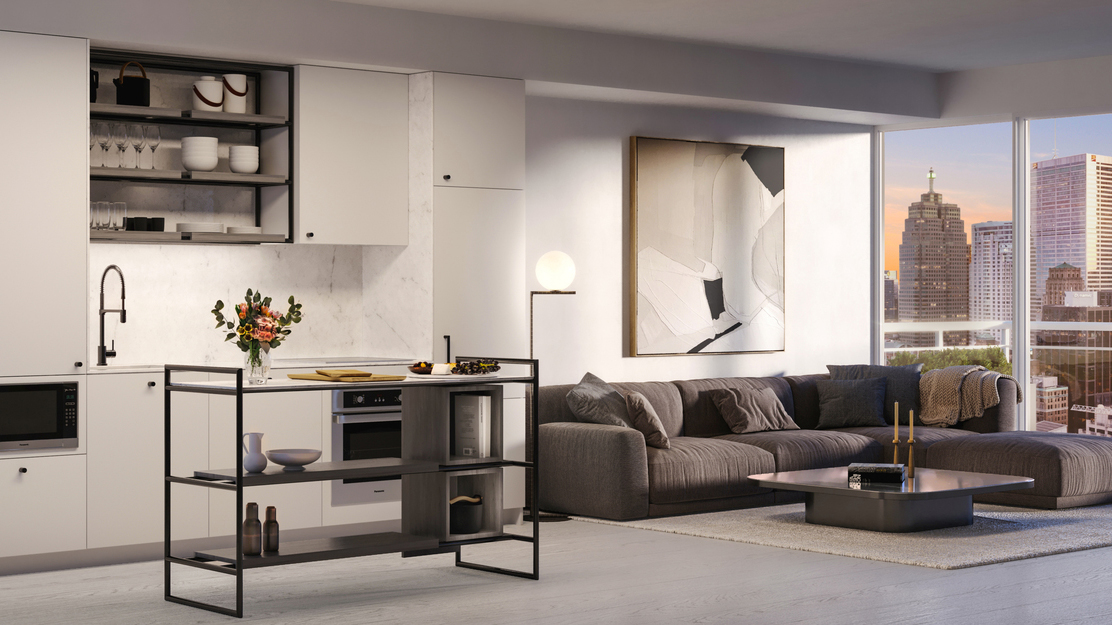 The living room and kitchen of one of 88 Queen residences. It is also possible to see Toronto's skyline through the window