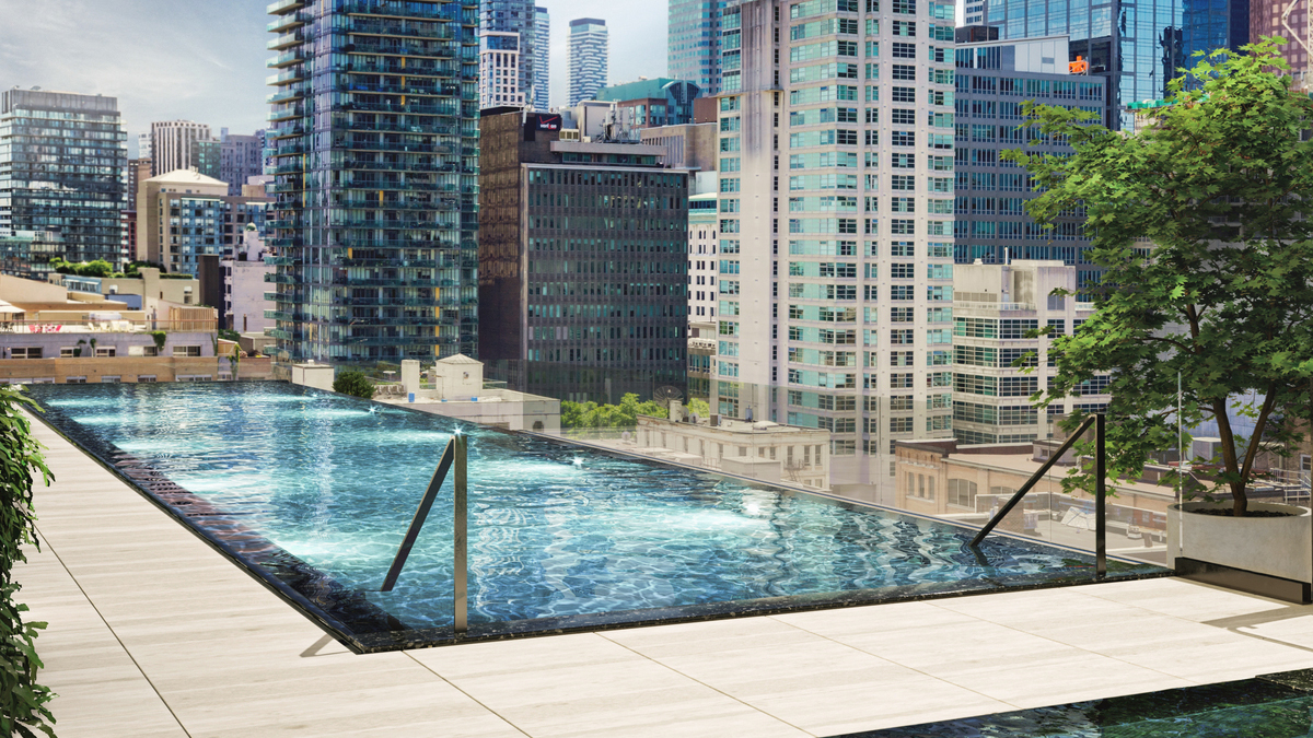 88 Queen rooftop pool with buildings in the background