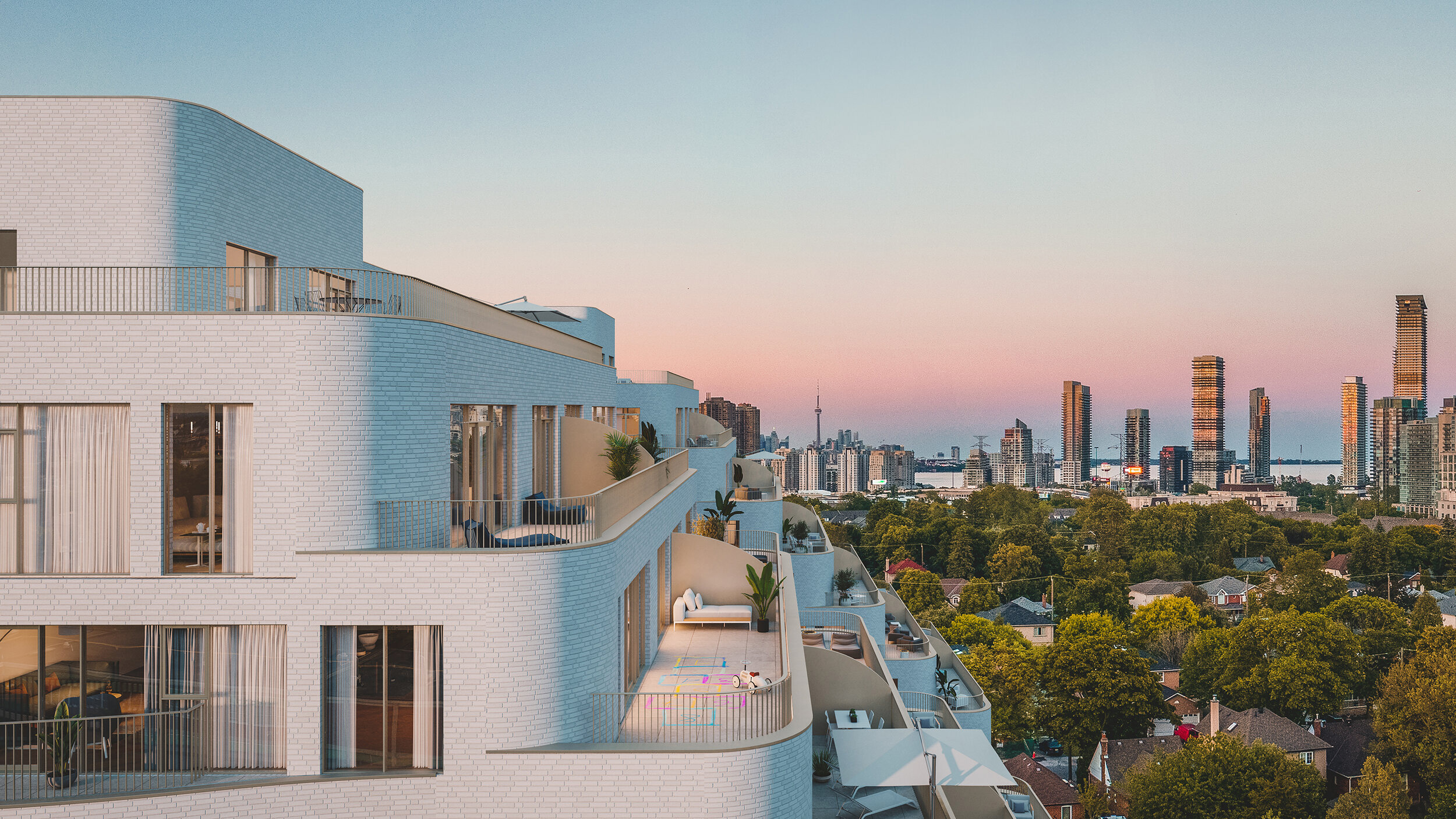 Reina urban condominium living building with a closeup of the balconies and Toronto's skyline in the background