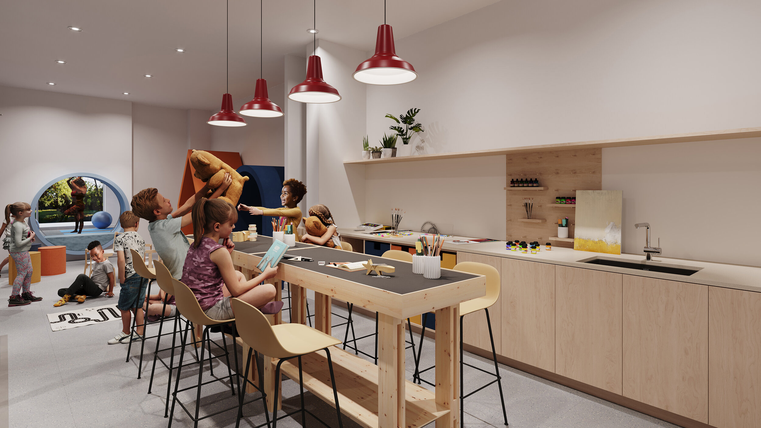 Kids inside one of Reina's amenities spaces, the Kids Zone