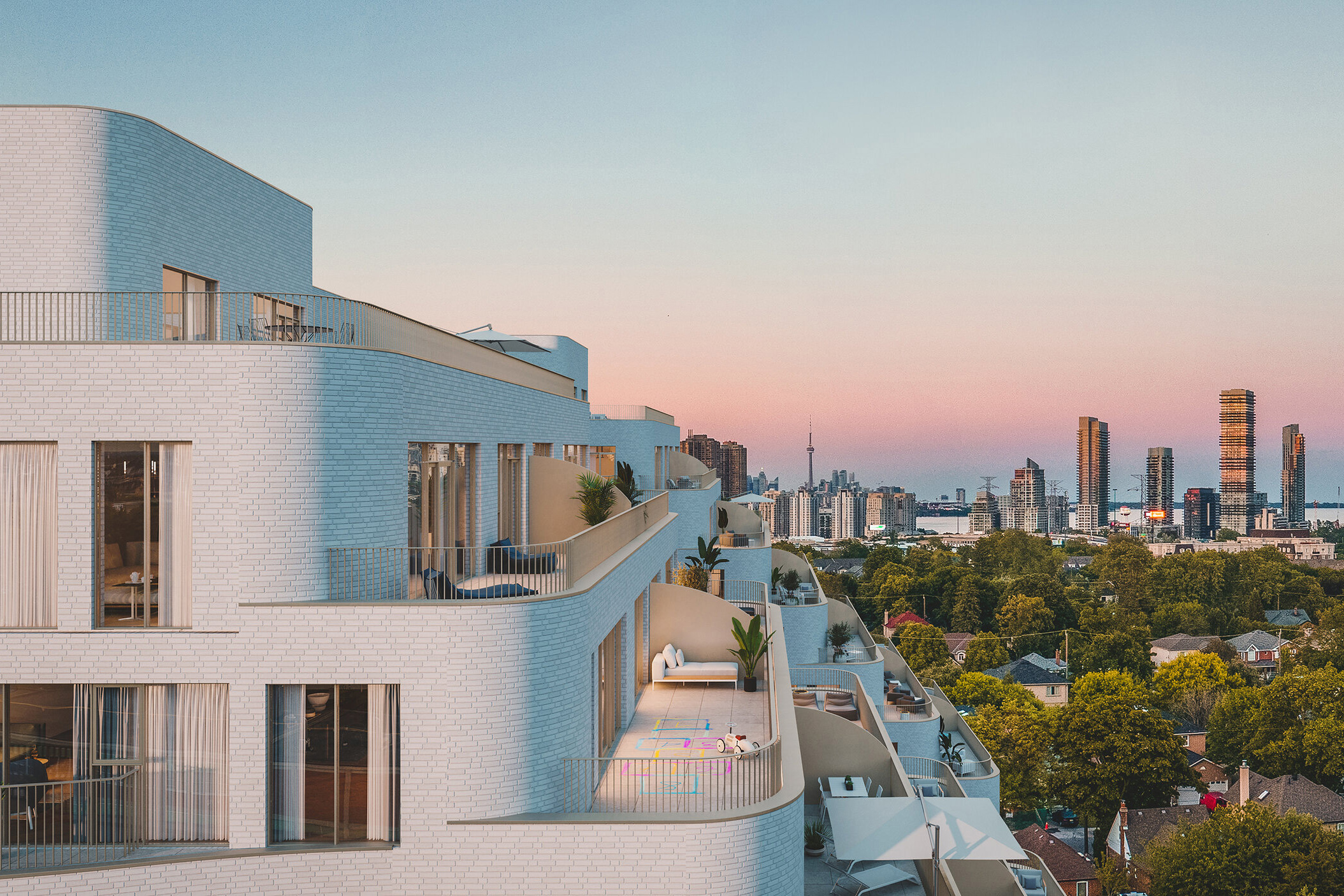 Reina urban condominium living building with a closeup of the balconies and Toronto's skyline in the background