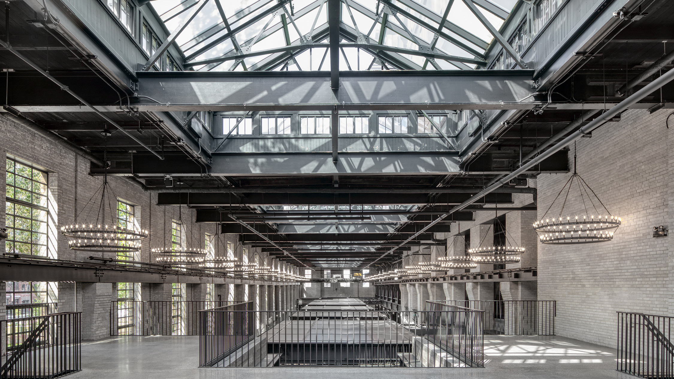 The inside of Waterworks Food Hall showing a large window and chandeliers